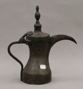 An antique Ottoman brass ewer, with an unusual incised mark. 30.5 cm high.