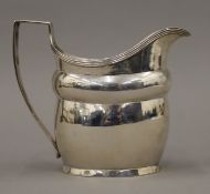 A Georgian silver cream jug. 10 cm high. 139.6 grammes.