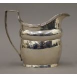 A Georgian silver cream jug. 10 cm high. 139.6 grammes.