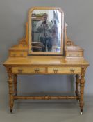 An Arts and Crafts inlaid ash dressing table, en-suite (see also the previous and next lots).