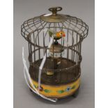 A cloisonne birdcage clock. 21 cm high.