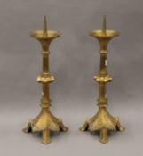 A pair of 19th century brass altar sticks. Each 46 cm high.