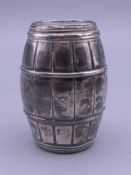 A silver barrel form pepper. 5.5 cm high. 50.6 grammes.