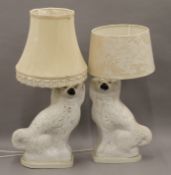 Two 19th century Staffordshire pottery dogs mounted as table lamps.