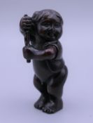 A 19th century netsuke formed as a boy. 5 cm high.