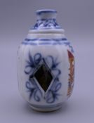 A Chinese porcelain snuff bottle. 7 cm high.