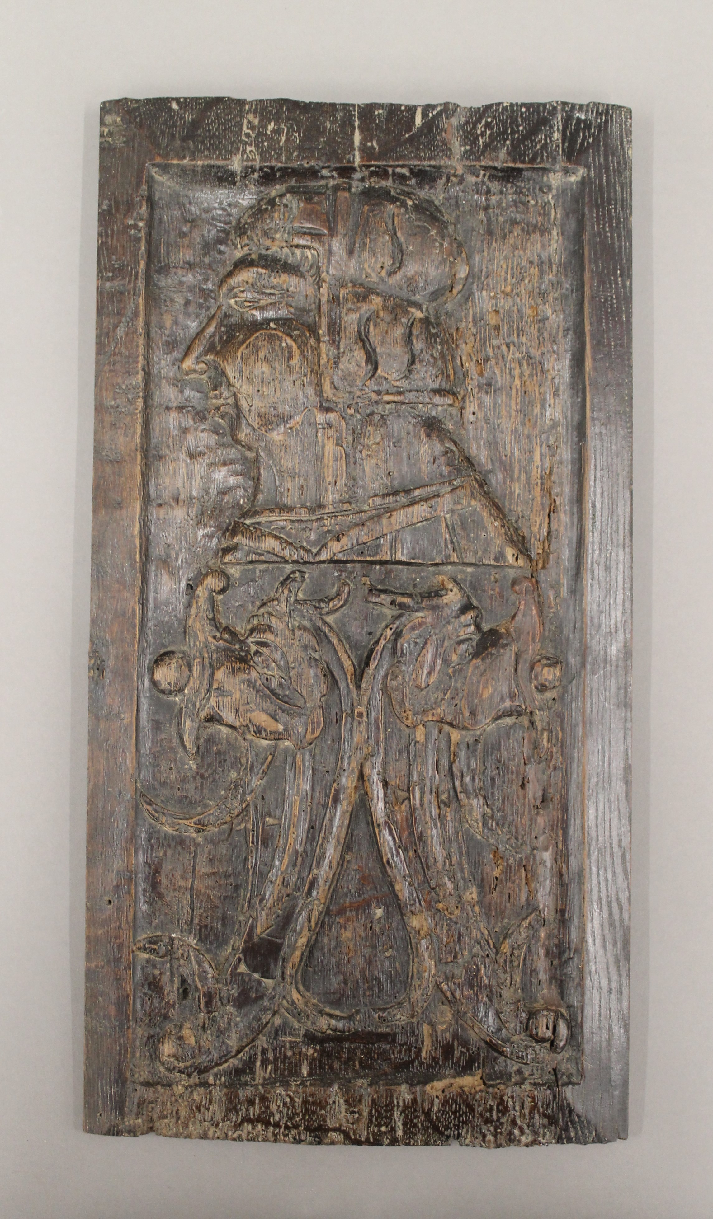 An early carved oak panel, possibly 16th/17th century. 41 cm high.