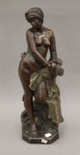 A 19th century terracotta semi-naked figure of a Nubian slave girl in handcuffs, signed J Jacques.
