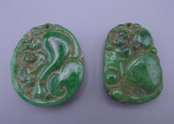 Two jade pendants. Each 5 cm high.