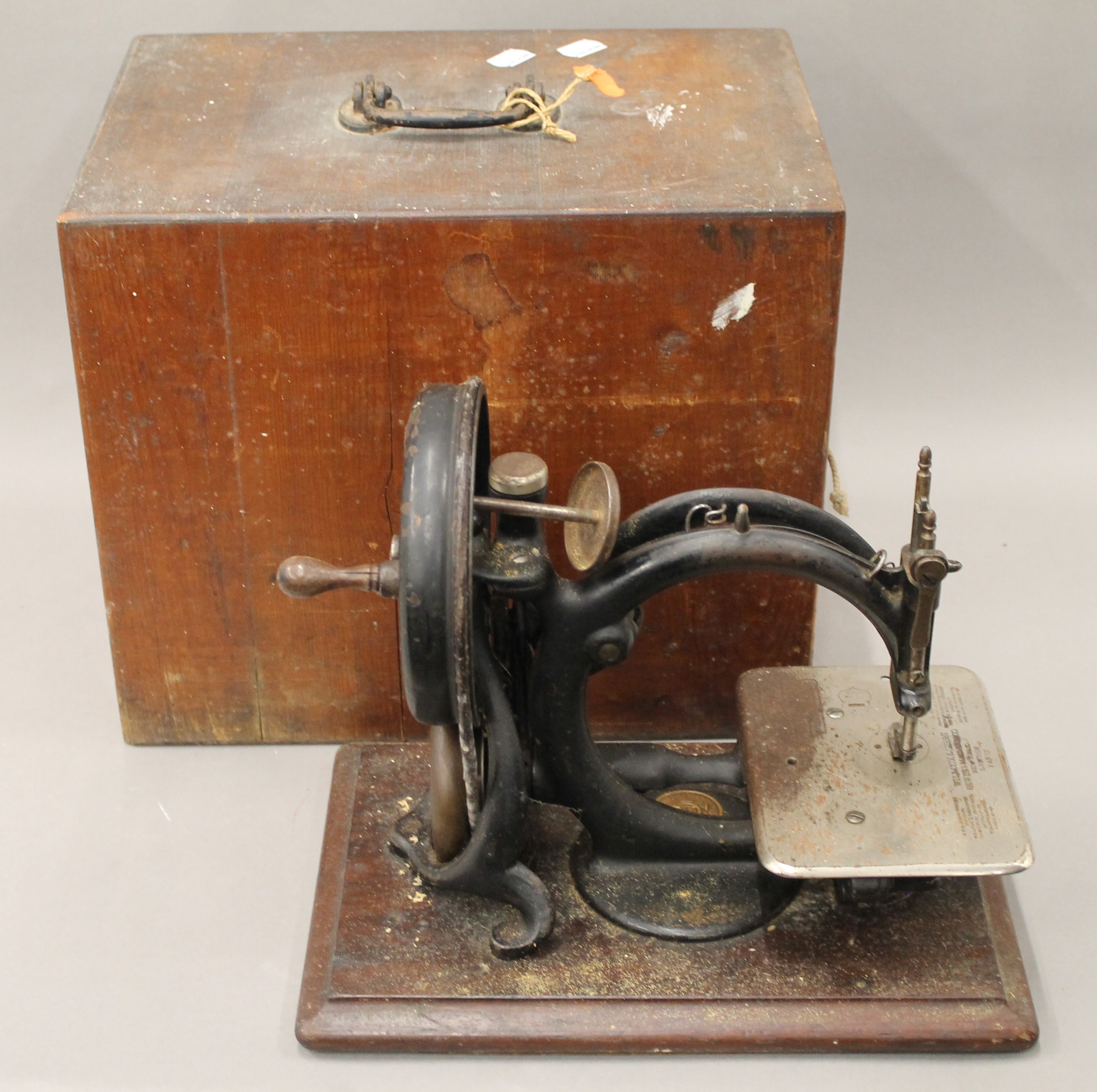 A Wilcox and Gibbs cased sewing machine.