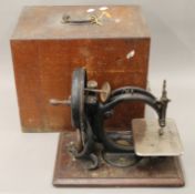 A Wilcox and Gibbs cased sewing machine.