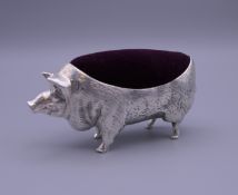 A pin cushion formed as a pig. 10.5 cm long, 5.25 cm high.