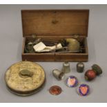 A boxed set of scales, a lawn tennis measure, enamel badges, etc.