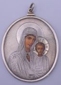 A Russian silver icon. 6.5 x 7.5 cm excluding suspension loop.