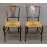 A pair of Victorian inlaid rush seated chairs.