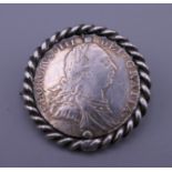 A 1787 sixpence coin brooch. 3 cm diameter.