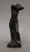 A small abstract bronze model of a nude. 29 cm high.