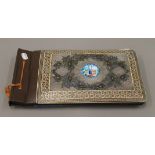 A Kashmiri photograph album with unmarked silver mounts. 36.5 cm wide.