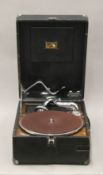 A H.M.V. portable gramophone.