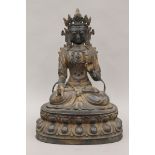 A Chinese bronze seated model of Buddha. 36 cm high.