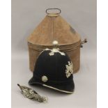 A Victorian Policeman's helmet in toleware tin. 34 cm high overall.