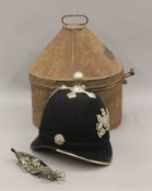 A Victorian Policeman's helmet in toleware tin. 34 cm high overall.