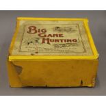 A vintage boxed Big Game Hunting mechanical toy. The box 20 cm wide.