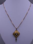 A pendant on chain. Pendant 2.5 cm wide x 4 cm high, chain 44 cm long.