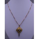 A pendant on chain. Pendant 2.5 cm wide x 4 cm high, chain 44 cm long.