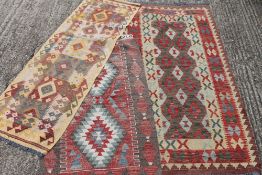 Three small Kilim rugs. The largest 100 x 201 cm.