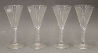 Four air twist stem drinking glasses. 20.5 cm high.