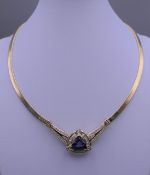 A 14ct gold tanzanite and diamond necklace. Approximately 46 cm inner circumference. 35.