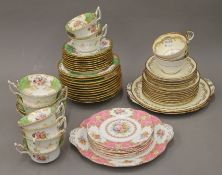 A quantity of florally decorated porcelain tea wares, including Coalport and Aynsley.