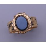 An 18 ct gold mourning ring. Ring size T/U. 7.2 grammes total weight.