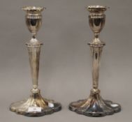 A pair of silver candlesticks. 30 cm high. 1483.6 grammes total weight.