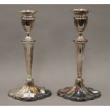 A pair of silver candlesticks. 30 cm high. 1483.6 grammes total weight.