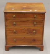 A small 19th century inlaid mahogany chest of drawers. 57 cm wide.