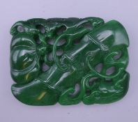 A jade bat and bamboo pendant. 7 x 5.25 cm.