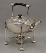 A Mappin and Webb 'Princes Plate' kettle on stand, in the manner of Christopher Dresser, circa 1910.