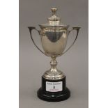 A small silver lidded trophy cup. 18.5 cm high overall. 202.2 grammes.