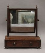 A 19th century mahogany toilet mirror.