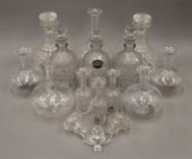 A quantity of various decanters, etc.