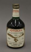 A bottle of Rosslea Finest Scotch Whisky.