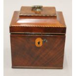 A small George III mahogany tea caddy. 12.5 cm wide.