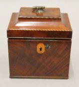 A small George III mahogany tea caddy. 12.5 cm wide.