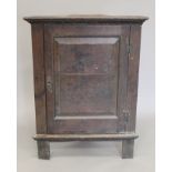 An 18th century oak corner cupboard. 192 cm high.