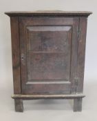 An 18th century oak corner cupboard. 192 cm high.