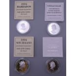 Four silver proof cased coins, with certificates.