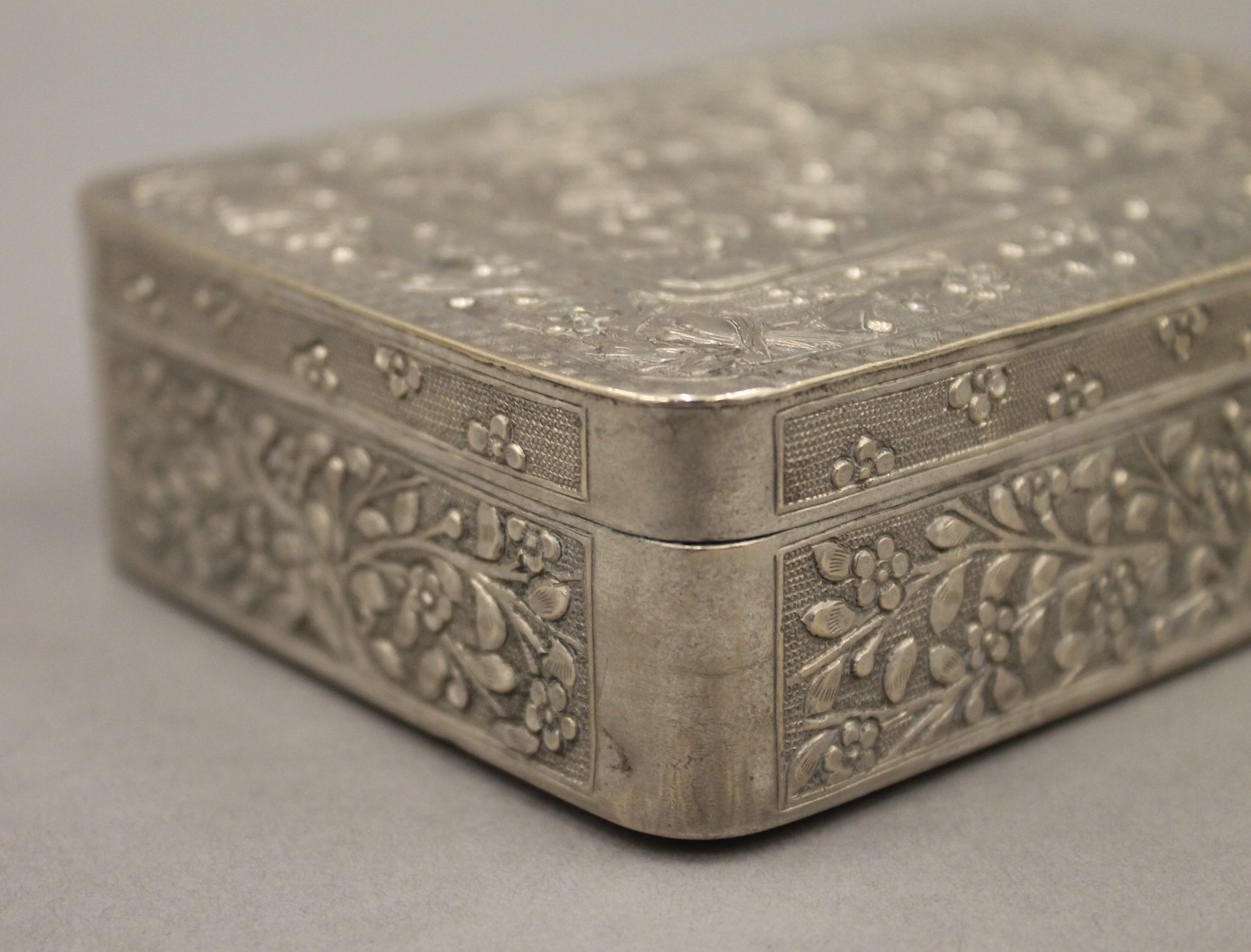 A 19th century Chinese silver box engraved with figures and trees, etc., seal marks to base. - Image 5 of 7