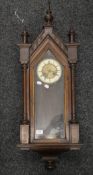 A 19th century walnut cased Vienna wall clock. 99 cm high.